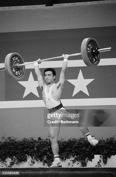 Los Angeles, CA: Japan's Kazuhito Manabe lifts on one foot on his way to a bronze medal in the 52 Kg class weightlifting in the 1984 Olympics in Los...