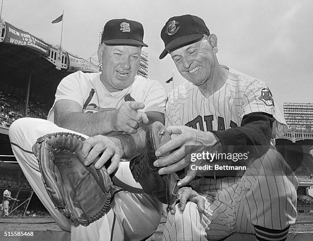 New York, NY: Dizzy Dean points out to Earl Averill, toe that liner off the bat of Averill broke during 1937 All-Star game. Scene took place during...