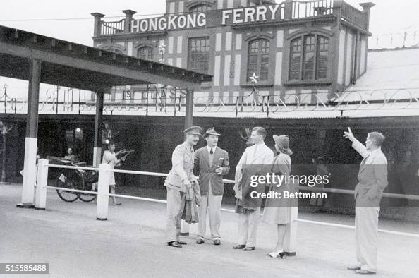 People Standing At Hong Kong Ferry Dock People Standing At Hong Kong Ferry Dock