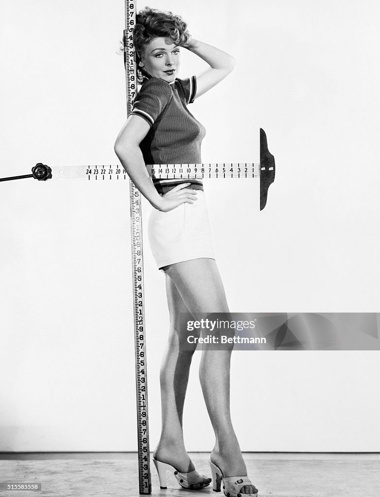 Actress Joan Vohs Standing Against T-Square Ruler