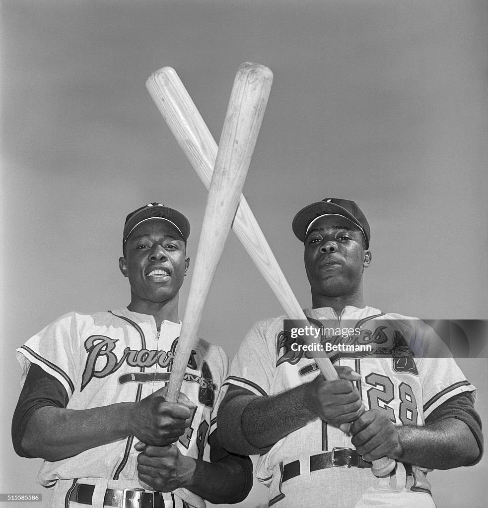Hank Aaron and Brother Tommy Aaron Crossing Bats