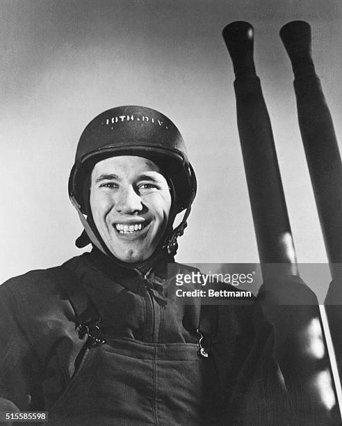 Bob Feller, former Cleveland Indians' ace pitcher, is the captain of a 40 mm. Gun crew aboard one of Uncle Sam's new battleships and is pitching...