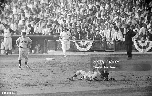 Pittsburgh, PA: Forbes Field: Yankee second baseman Bobby Richardson leans over shorstop Tony Kubek after a ground ball took a bad hop and hit Kubek...