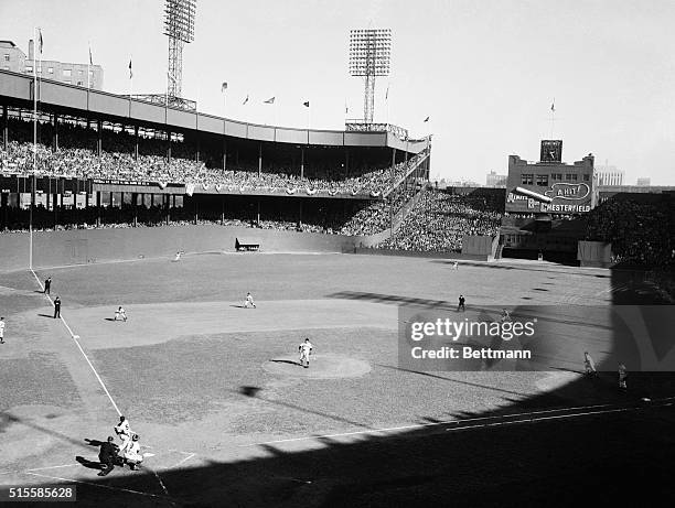 New York, NY: Joe DiMaggio, the Yankee Clipper, is shown the instant after he slammed a two-run homer into the upper deck of the left-field stands at...