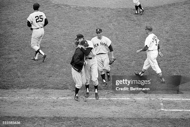 St. Louis, MO: Yankee pitchers Jim Bouton and Steve Hamilton hug each other on the field after the final Cardinal man is retired in the sixth game of...
