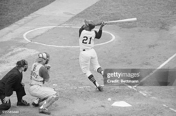 Pittsburgh, PA: Pirates' Roberto Clemente grimaces as he is hit in the back by a pitched ball thrown by Cincinnati's Sammy Ellis in the first inning...