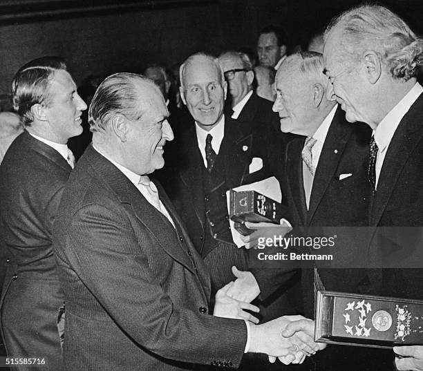 Oslo, Norway: Prince Harald and King Olav V of Norway congratulate winners of the 1962 and 1963 Nobel Peace Prizes at official presentation...