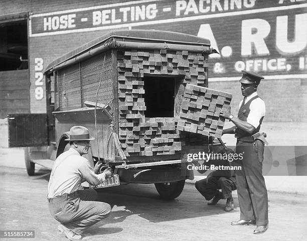 What appeared to be an innocent truckload of lumber, turned out to be a bootlegger's vehicle loaded with prime scotch when the Los Angeles Federal...