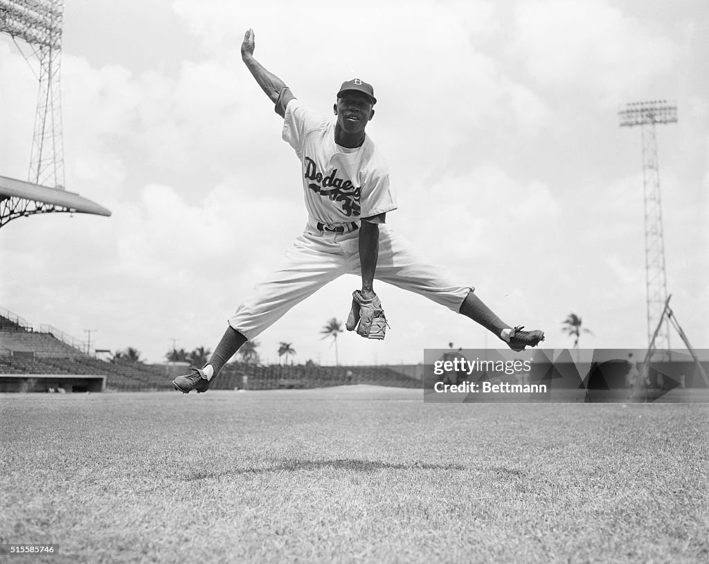 Junior Gilliam Jumping With His Legs Spread