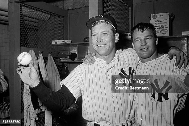 New York, NY: Mickey mantle , whose ninth inning homer won third game of World Series for the Yankees, 2-1, October 10, celebrates in dressing room...