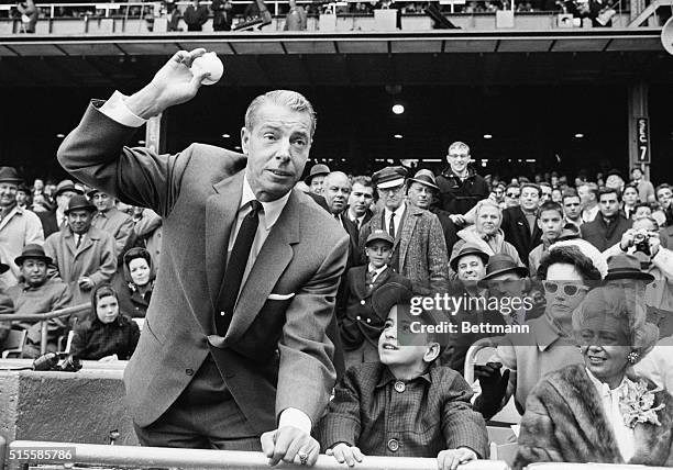 New York, NY: Israel Camachio looks on admiringly as his hero, as baseball's Hall of Famer Joe DiMaggio tosses out the first ball at the opening home...