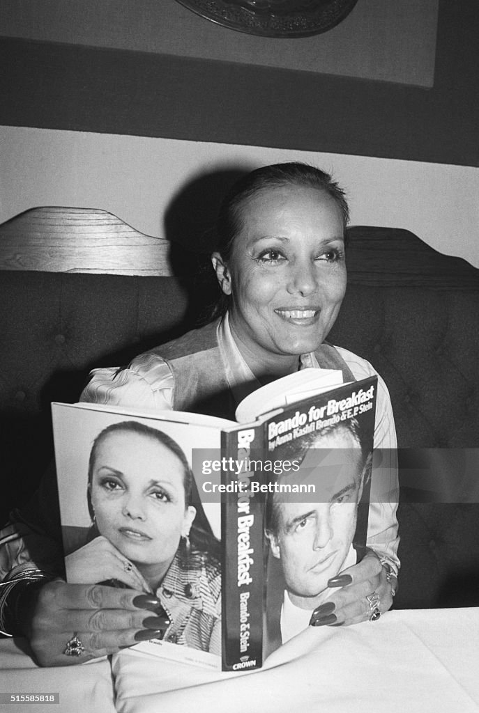 Anna Kashfi Brando Holding Book She Wrot