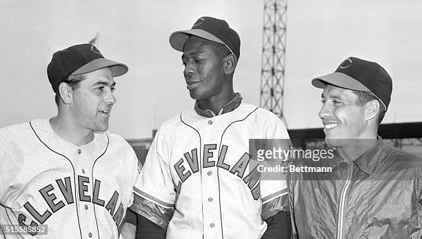 St. Louis, MO: Lou Boudreau , manager-shortstop of the Cleveland Indians, stands with two of his ailing aces in St. Louis. In the center is pitcher...
