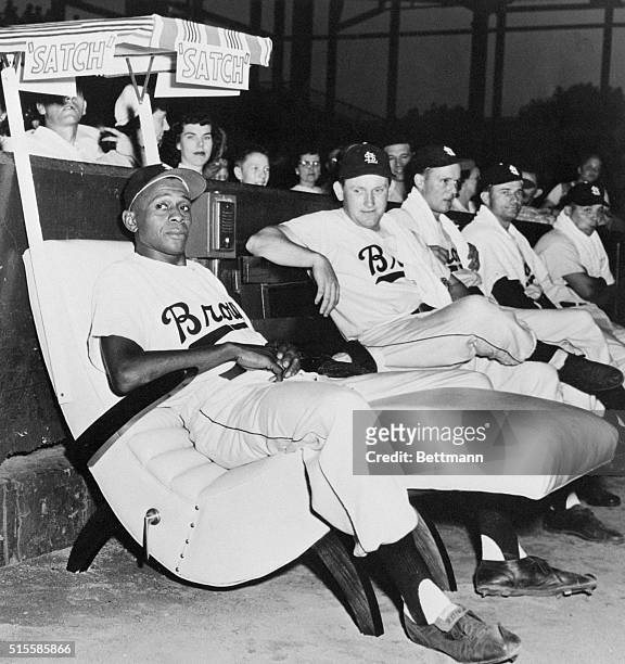 St. Louis Browns' relief pitcher Leroy "Satchel" Paige, a star pitcher in the Negro Leagues for many years, relaxes in a new easy chair in the...