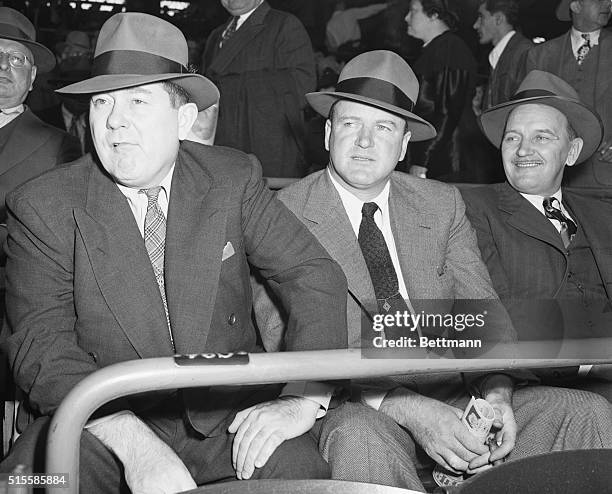Tom Yawkey and Joe Cronin , respective owner and club manager of the Boston Red Sox, watch the Brooklyn Dodgers and St. Louis Cardinals at Ebbets...