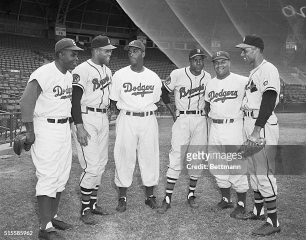 Former Negro League and current National League players stand together before a spring training game between the Brooklyn Dodgers and Boston Braves...