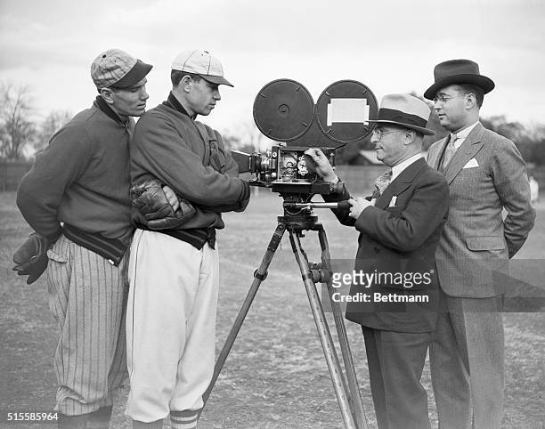 St. Louis Cardinals pitchers Dizzy and Daffy Dean are shown a movie camera during the making of a short Warner Brothers film. From left to right:...