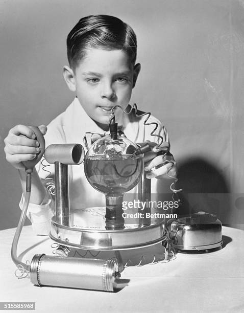 New York,NY: 47th Annual American Toy Fair, Atomic Lab for Junior - Bobby Miller, 7 1/2 years old, plays with an Atomic Laboratory set for junior...
