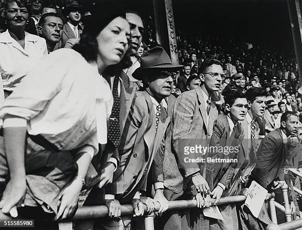 New York, NY: This view of fans seated in Yankee Stadium watching the sixth World Series game illustrates the extreme anxiety and tenseness of the...
