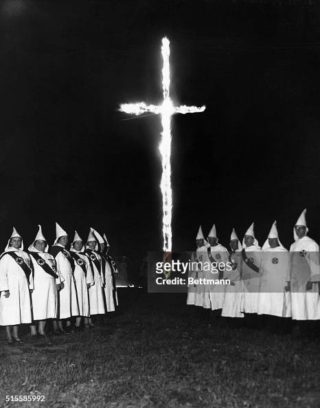 A Group of Klan Men and Women Burning Cross