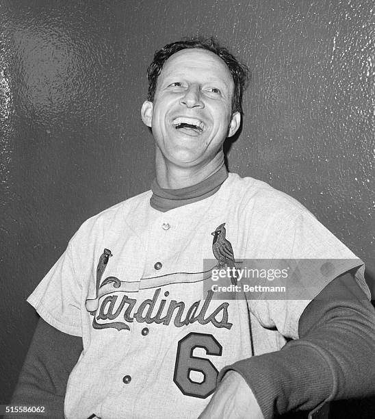 New York, NY- Stan Musial, St. Louis Cardinals immortal, smiles in the Polo Grounds clubhouse after he got two singles to tie Babe ruth's lifetime...