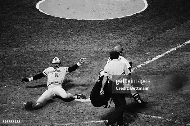 Boston, MA: Baltimore Orioles' Reggie Jackson is safe at home plate, as Bosox catcher Carlton Fisk waits for a throw from centerfielder Fred Lynn,...