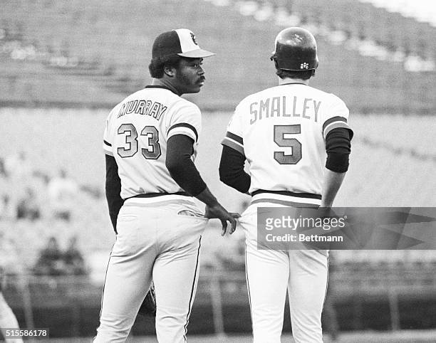 Bloomington, MN Baltimore Orioles' first baseman Eddie Murray isn't a pickpocket, he his only being friendly to Minnesota Twins' Roy Smalley, as...