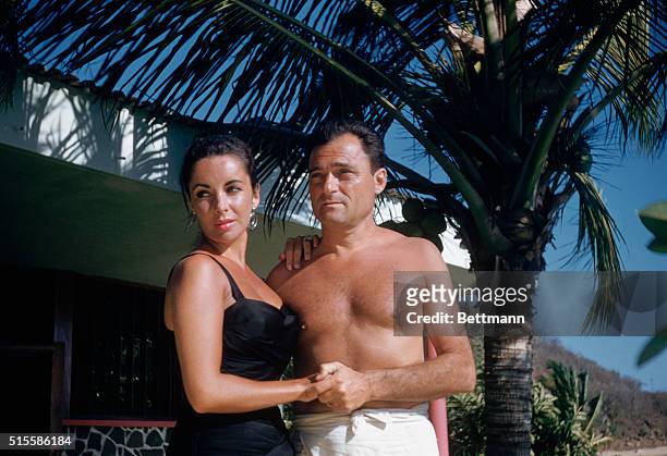 Acapulco, Mexico: Portrait of Elizabeth Taylor and husband Mike Todd at their honeymoon retreat.