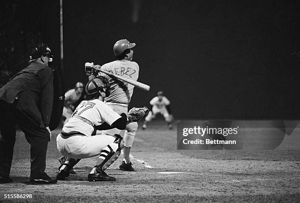 Boston, MA- Carlton Fisk of the Red Sox brings his bat around before connecting for the game-winning home run in the twelfth to defeat the Cincinnati...