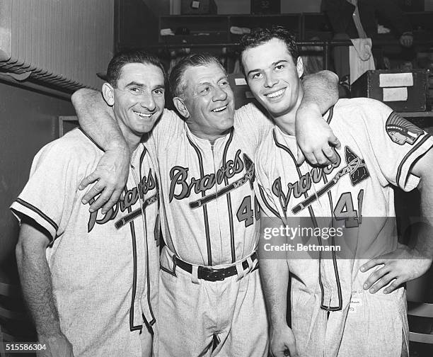 Outfielder Sid Gordon, manager Charley Grimm, and third baseman Eddie Mathews of the Milwaukee Braves are three happy ballplayers in their locker...