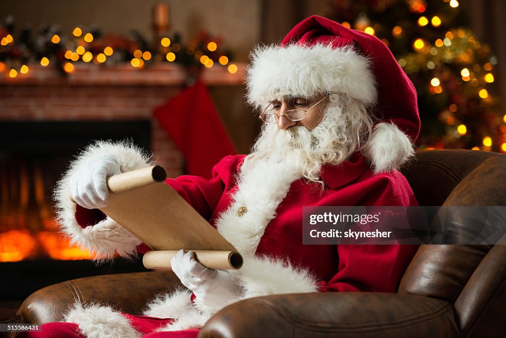 Santa Claus reading a list.