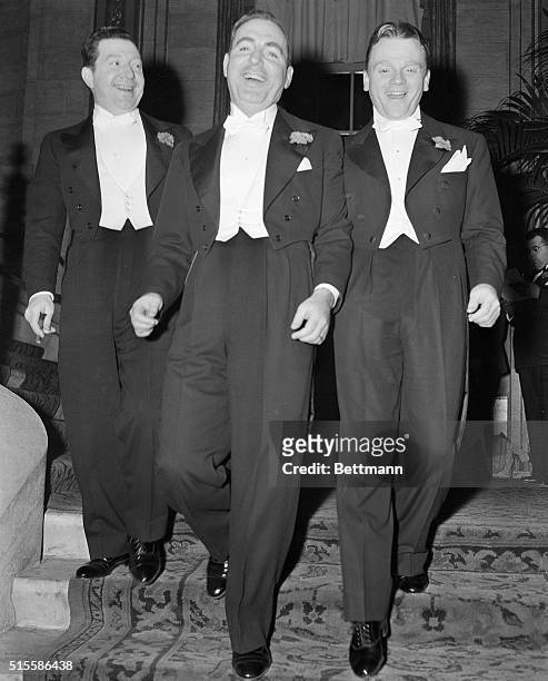 Los Angeles, CA- Frank McHugh, Pat O'Brien, and Jimmy Cagney strut into the Biltmore Bowl to attend the awards dinner of the Academy of Motion...