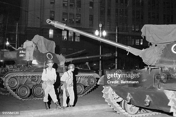 Rio de Janeiro, Brazil-Troops manning medium tanks guarded the War Ministry throughout the night as rumblings began against the leftist-leaning...