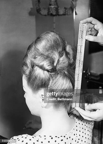 As can be seen at a glance here, Dolly Dawn's hair-do measures 11 inches from the nape of the neck to the tip of the crown. High fashion. The...