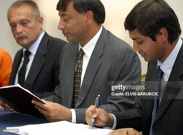 In this picture taken 16 August 2004, Vice Chairman of LNM Holding Aditya Mittal , Chairman Lakshmi Nivas Mittal and Bosnia and Herzegovina Prime...