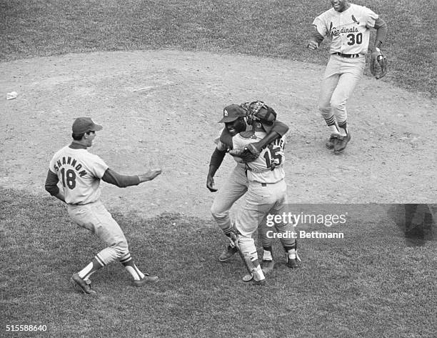 Boston, MA: Cardinals' catcher Tim McCarver hugs pitcher Bob Gibson after he hurled a 3-hit ball game to win the 1967 World Series for St. Louis....