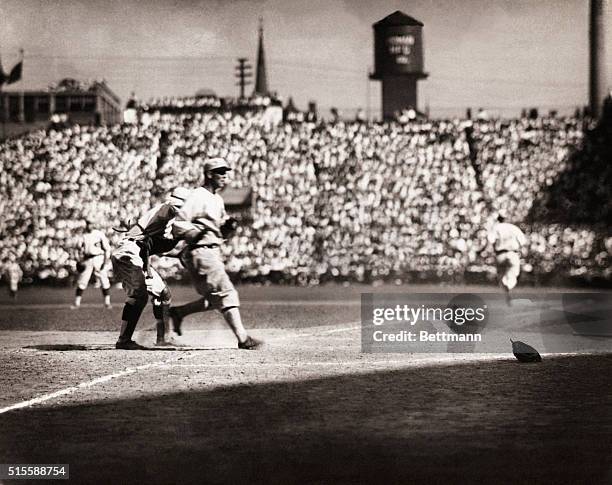 Bill Rariden of the Cincinnati Reds tags Buck Weaver of the Chicago White Sox out at home plate in the second game of the 1919 World Series at...