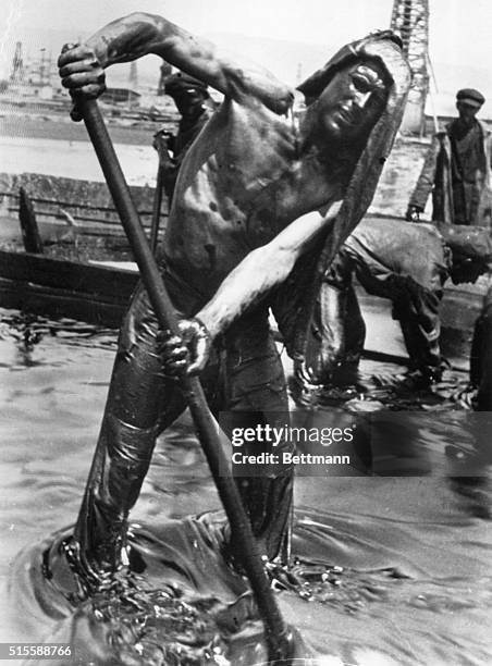 Baku, Russia: Soviet worker drenched with oil at a well in Lock-Batan, in the suburbs of Baku.