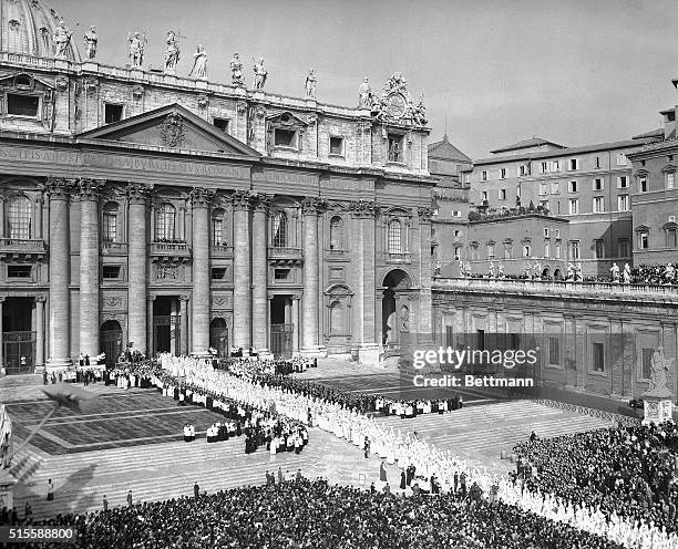 Vatican City, Italy- White-clad Council Fathers walk into St. Peter's Basilica early October 11th, at the beginning of the world's 21st Ecumenical...