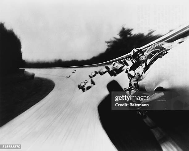 Actor James Garner leads the pack of Formula Ones in the 1966 film Grand Prix, the first film to capture the thrill of the track by mounting a camera...