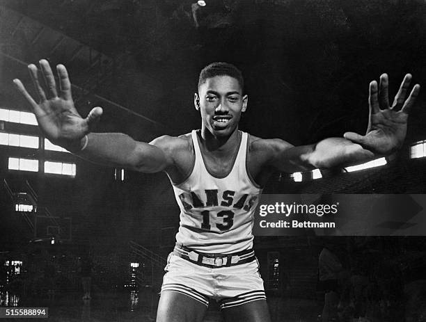 Wilt "The Stilt" Chamberlain, 7-foot Kansas Center, displays the mitts which have deflected 127 enemy shots during Kansas' first twenty games this...