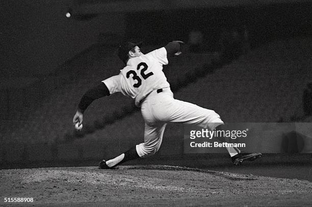 Los Angeles, CA: Sandy Koufax, who later claimed to have known all along he was pitching a no-hitter, shows the strain of a perfect game in this...