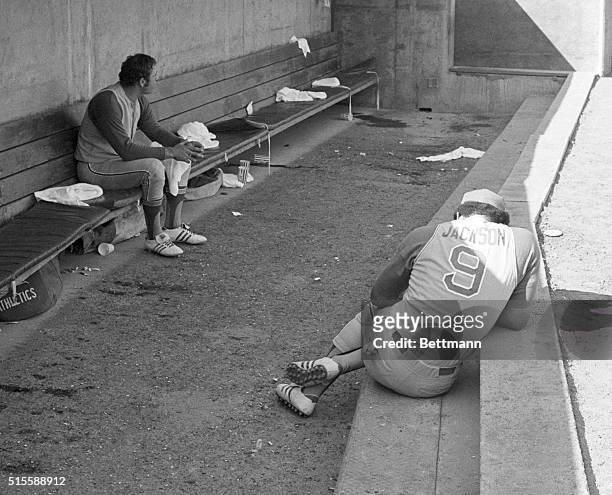 Oakland, CA: Oakland Athletics' Reggie Jackson is all alone and hunched over in the A's dugout after the Baltimore Orioles won the 3rth consecutive,...