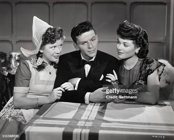 Marcy McGuire , Frank Sinatra, and Barbara Hale in a still from the movie Higher and Higher. Sinatra was just beginning his solo career as a...