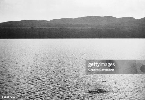 Scotland: Authentic Picture Of Loch Ness "Monster." The dark blotch ruffling the surface of Loch Ness in Scotland is reputedly a disturbance caused...