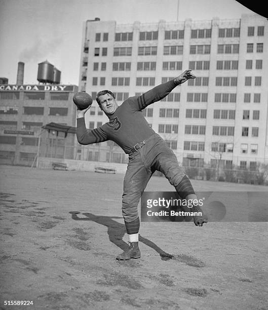 Bronco Nagurski, star back of the Chicago Bears, prepares to hurl a pass during a practise session of the Bears at De Witt Clinton Park, New York...