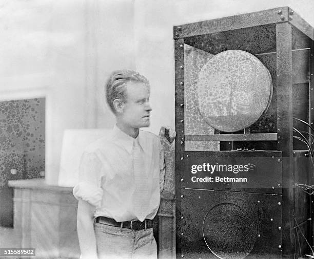 Pictured above is Philo Farnsworth, 27-year-old inventor of a television set, as he watched a televised picture of Joan Crawford as it appeared on...