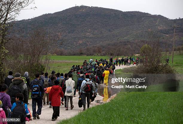 Migrants trek towards Macedonia after leaving the Idomeni refugee camp, on March 14, 2016 in Idomeni, Greece. The decision by Macedonia to close its...