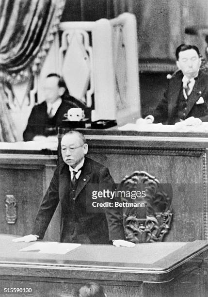 Premier Admiral Keisuke Okada, pictured as he addressed the House of Peers, during a session of the body in Tokyo is shown. President Fumimaro Konoye...