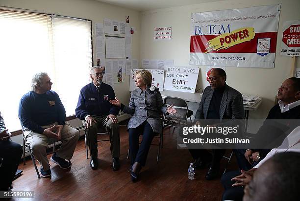 Democratic presidential candidate Hillary Clinton talks with members of the Bakery, Confectionery, Tobacco Workers' and Grain Millers union who lost...